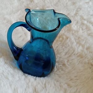 Lovely dark teal colored hand blown glass pitcher w 1 5/8" base,  4.5" tall